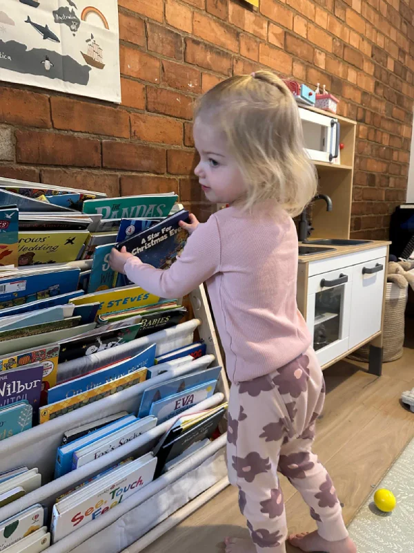 baby-girl-reading-book